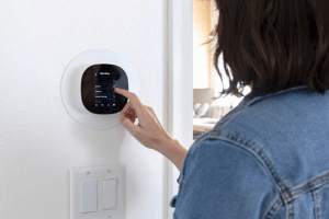 - Woman adjusting a smart thermostat on the wall to manage her home's heating and cooling settings.
Is this conversation helpful so far?